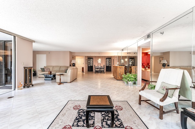 living room with a textured ceiling