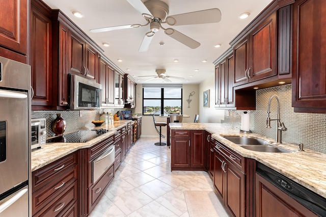 kitchen with sink, dishwashing machine, decorative backsplash, black electric stovetop, and kitchen peninsula