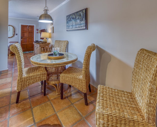 dining area featuring crown molding