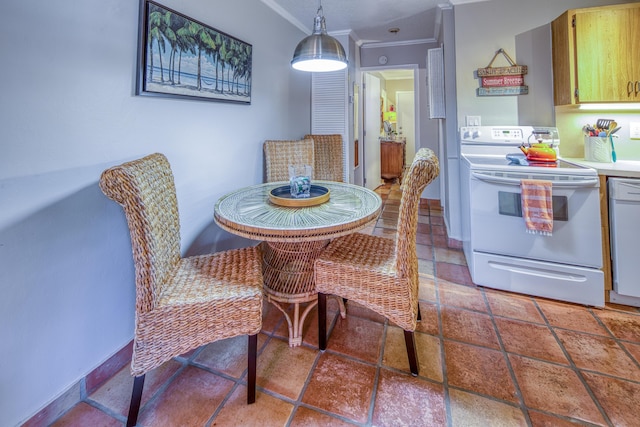 dining space with crown molding