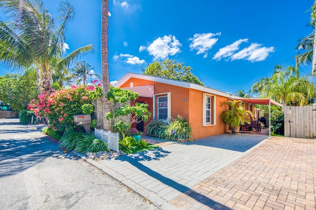 view of front of property with a carport