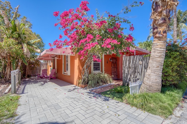 view of front of home with a patio