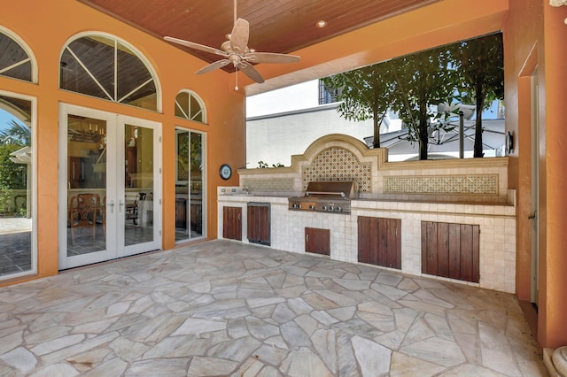 view of patio with ceiling fan, an outdoor kitchen, grilling area, and french doors