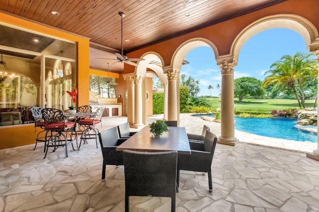 view of patio with ceiling fan and an outdoor kitchen