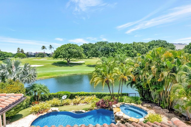 view of swimming pool featuring a water view