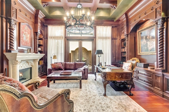 living area featuring french doors, an inviting chandelier, plenty of natural light, and coffered ceiling