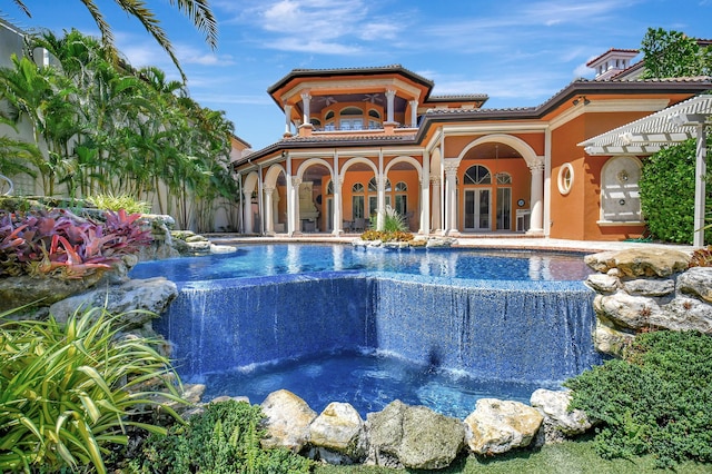 view of swimming pool featuring pool water feature