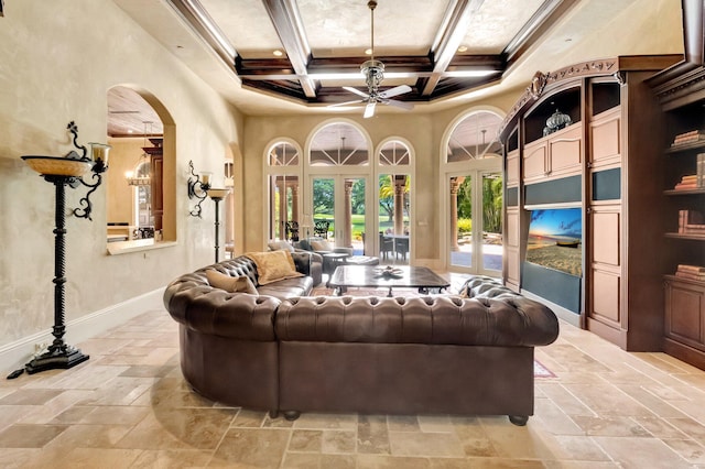 living room with ceiling fan, french doors, coffered ceiling, beamed ceiling, and ornamental molding