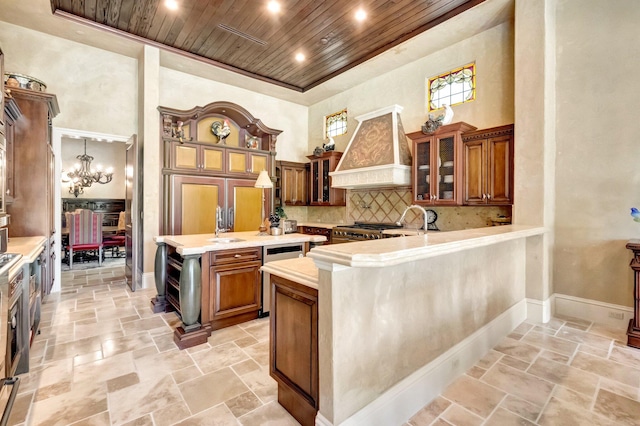 kitchen with kitchen peninsula, decorative backsplash, a kitchen bar, premium range hood, and wood ceiling