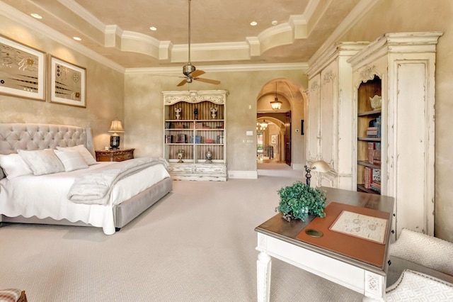 bedroom with carpet, ceiling fan, and ornamental molding