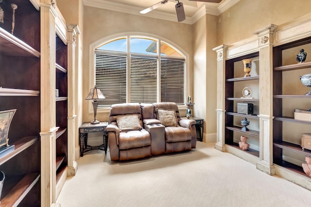 sitting room featuring carpet flooring, ceiling fan, and ornamental molding