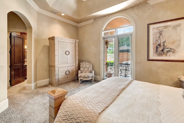 bedroom with access to exterior, a towering ceiling, light colored carpet, and ornamental molding