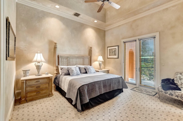 bedroom with ornamental molding, access to outside, ceiling fan, and a tray ceiling