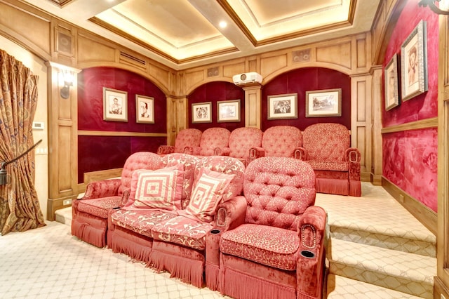 cinema room featuring carpet flooring, coffered ceiling, and ornamental molding