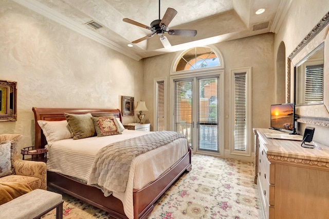 bedroom with ceiling fan, a raised ceiling, crown molding, and access to outside