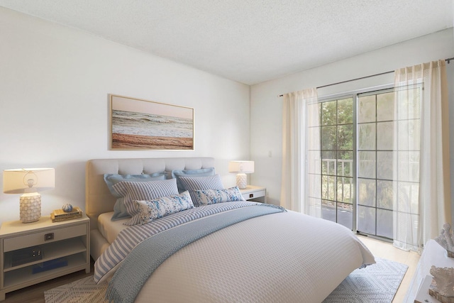 bedroom featuring light hardwood / wood-style floors and a textured ceiling