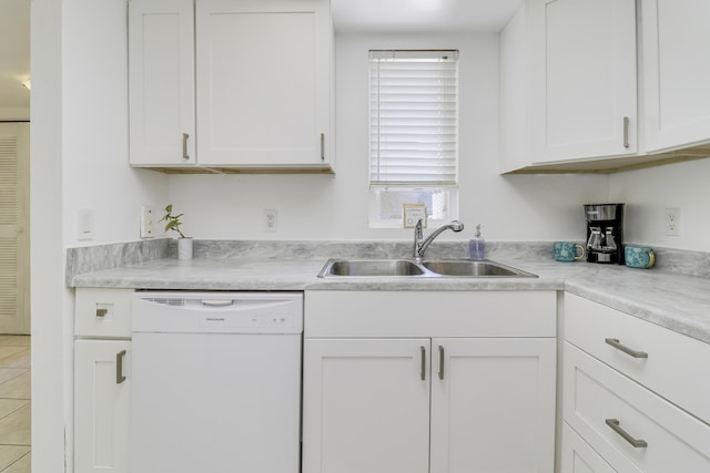 kitchen featuring dishwasher, white cabinetry, and sink