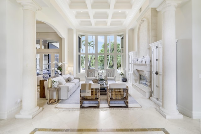 living area featuring beamed ceiling, a towering ceiling, crown molding, and coffered ceiling