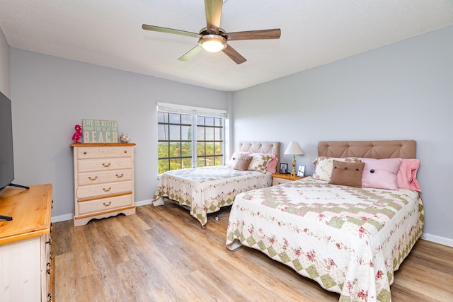 bedroom featuring ceiling fan and hardwood / wood-style flooring