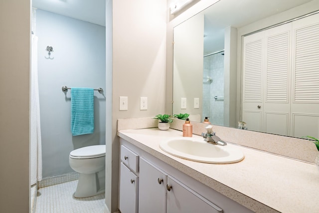 bathroom with tile patterned flooring, vanity, toilet, and walk in shower