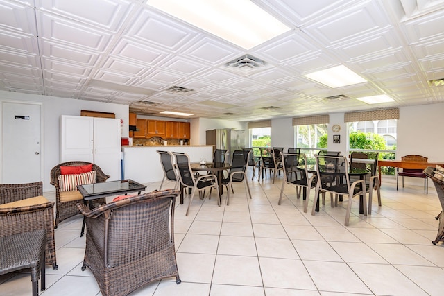 dining area featuring light tile patterned flooring