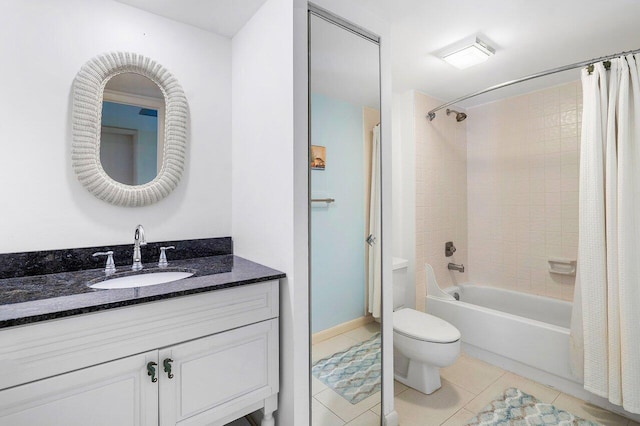 full bathroom featuring shower / tub combo with curtain, vanity, toilet, and tile patterned floors