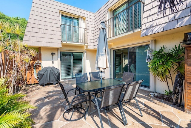 view of patio / terrace featuring a grill and a balcony