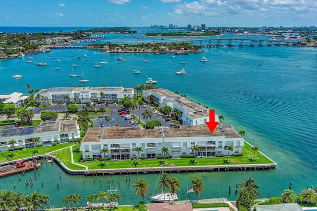 birds eye view of property with a water view