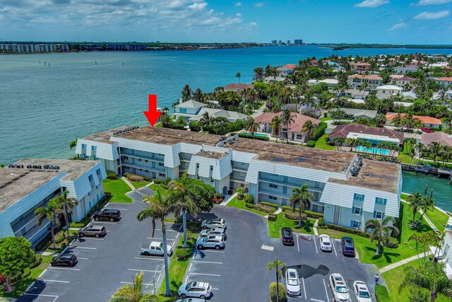 birds eye view of property with a water view