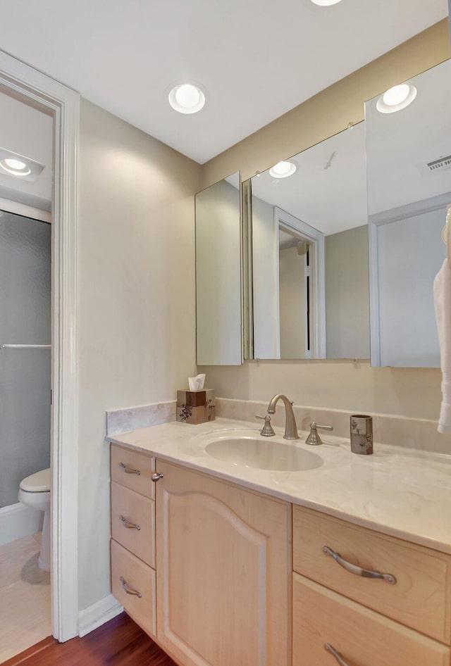 bathroom with vanity and toilet