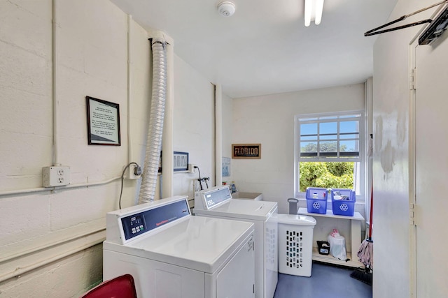 washroom with independent washer and dryer