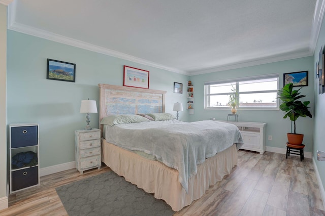 bedroom featuring light hardwood / wood-style floors and ornamental molding