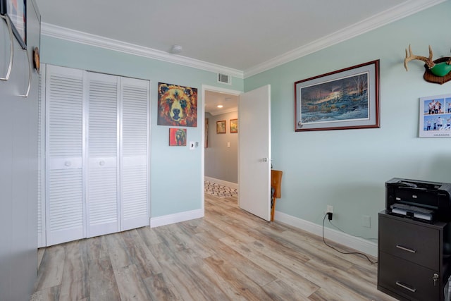 office featuring crown molding and light hardwood / wood-style flooring