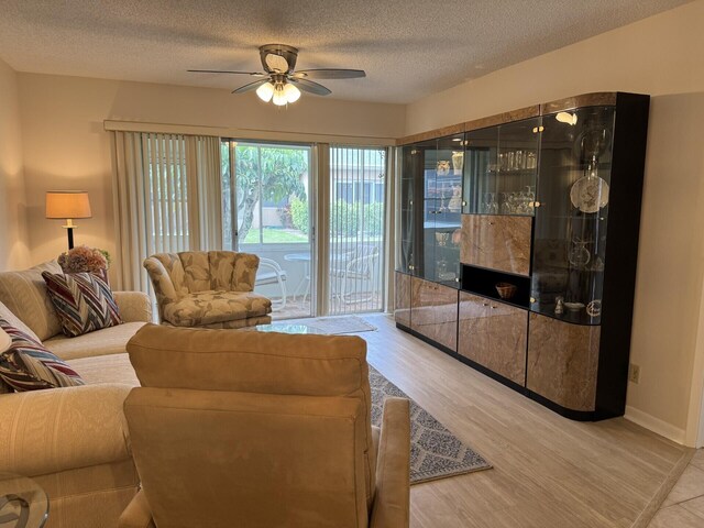 2541 Red Hibiscus Blvd Unit 31-B, Delray Beach, FL 33445 - living room featuring wood finished floors and ceiling fan