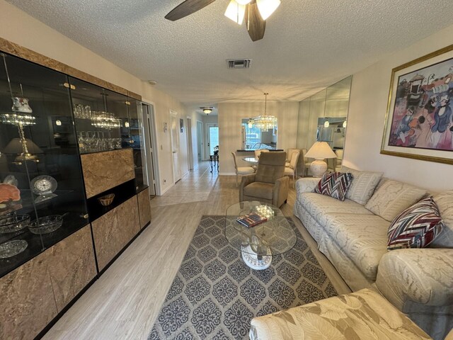 2541 Red Hibiscus Blvd Unit 31-B, Delray Beach, FL 33445 - kitchen with freestanding refrigerator, a sink, dark countertops, a textured ceiling, and stove