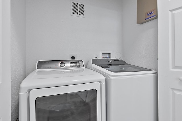 laundry room with electric dryer hookup, independent washer and dryer, and hookup for a washing machine