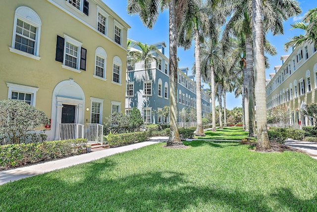 view of home's community with a lawn