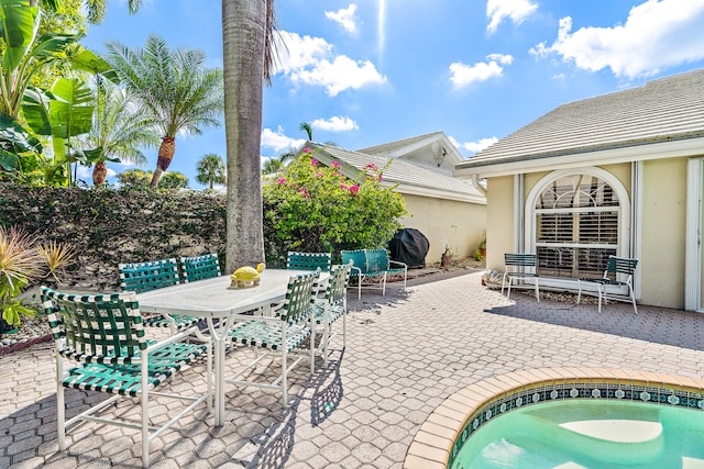 view of terrace featuring a jacuzzi