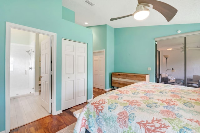 bedroom featuring hardwood / wood-style floors, ceiling fan, lofted ceiling, and a textured ceiling