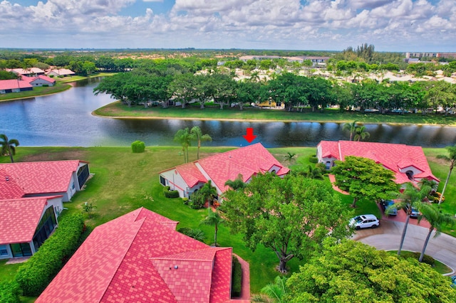 drone / aerial view with a water view