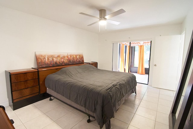 tiled bedroom featuring ceiling fan