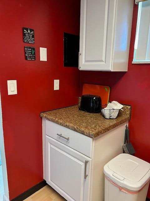 bathroom featuring wood-type flooring, vanity, and toilet