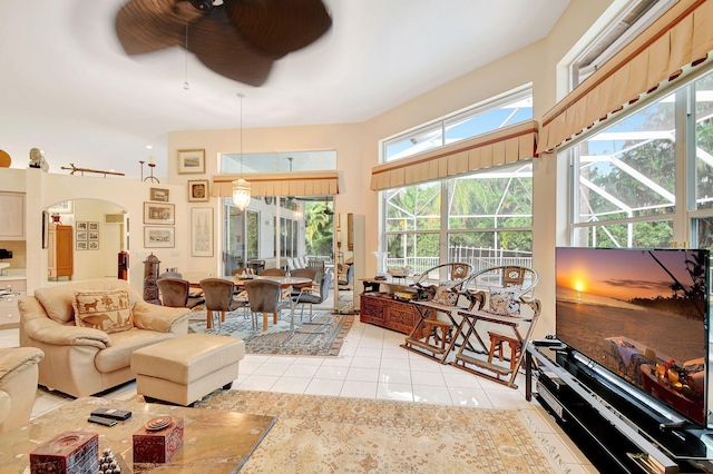 sunroom featuring ceiling fan