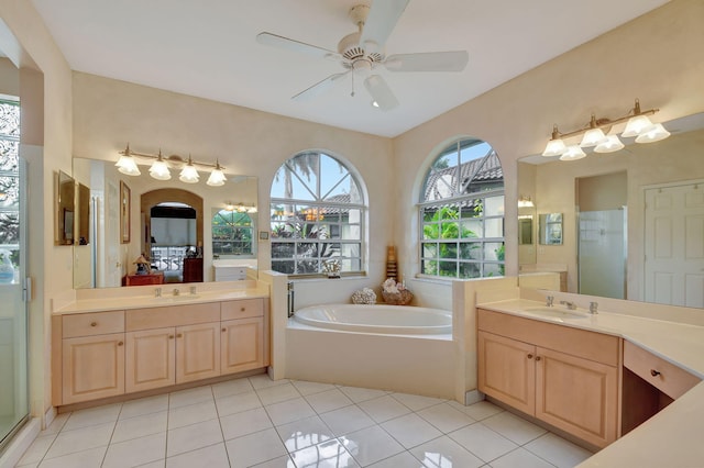 bathroom featuring vanity, independent shower and bath, tile patterned floors, and ceiling fan