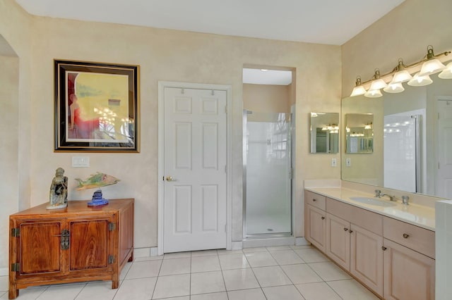 bathroom with vanity, walk in shower, and tile patterned flooring