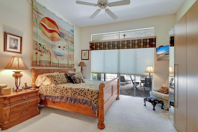 carpeted bedroom featuring access to outside and ceiling fan