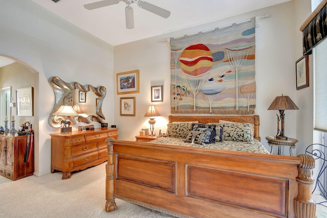 bedroom featuring light colored carpet and ceiling fan