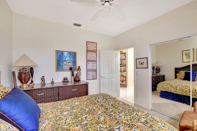 carpeted bedroom with a closet and ceiling fan