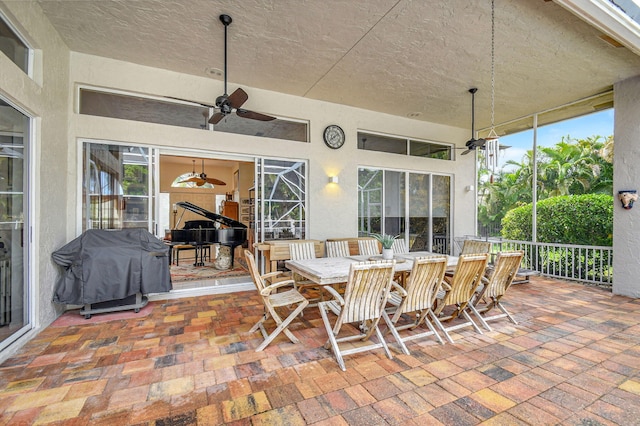 view of patio / terrace with area for grilling and ceiling fan