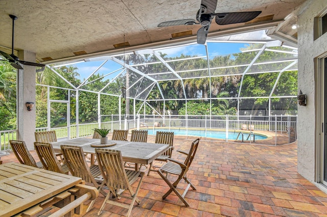 view of patio / terrace featuring a fenced in pool, a lanai, and ceiling fan